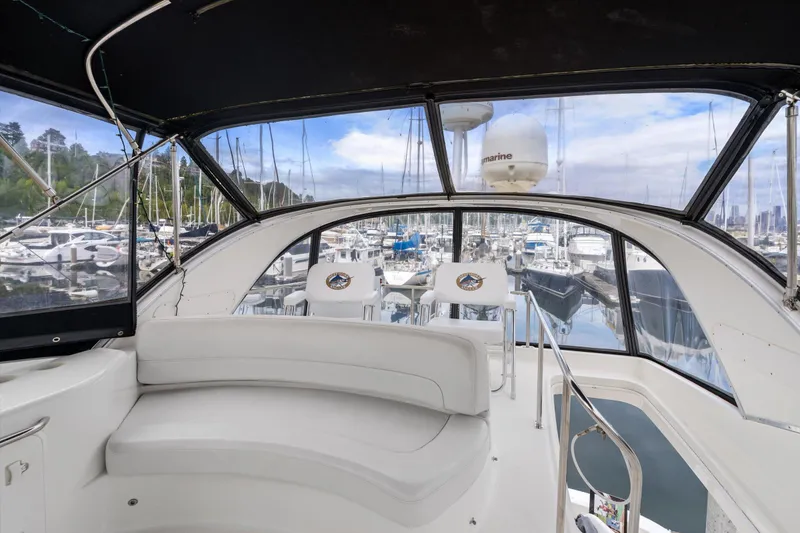 Slide: The Image of Interior view of 2006 Meridian 411 Sedan yacht with marina backdrop. - 3