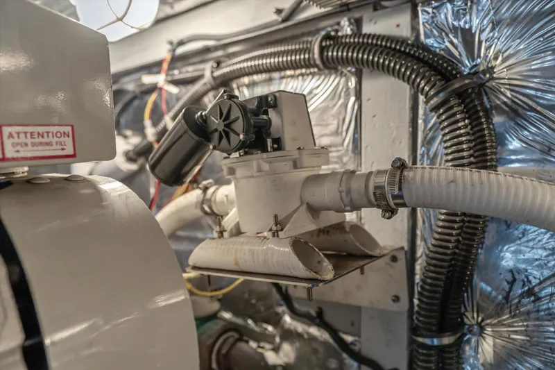 Slide: The Image of Engine room of 2006 Meridian 411 Sedan with hoses and mechanical components. - 31