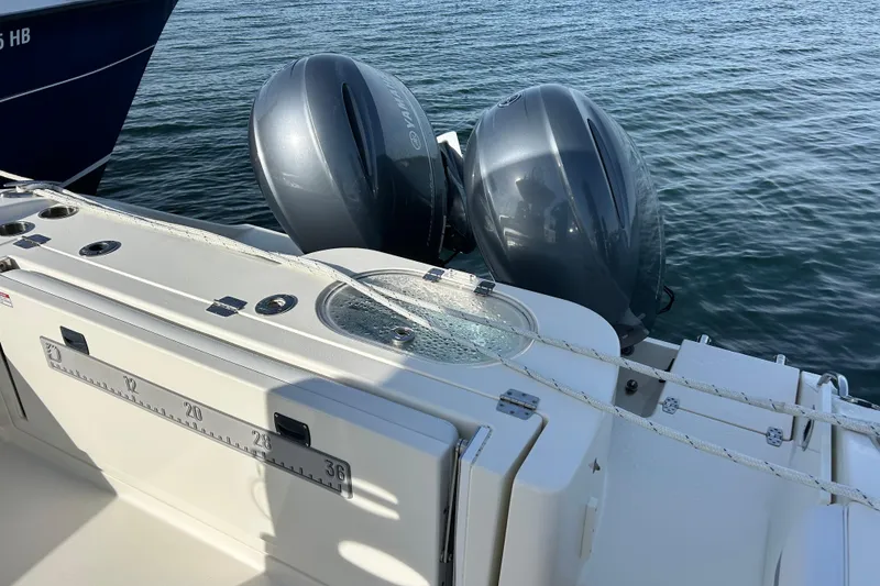 Slide: The Image of 2018 Cobia 227 boat with dual Yamaha outboard motors on water. - 3