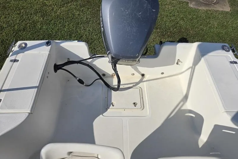 Slide: The Image of 2000 Scout 185 Sportfish boat deck with outboard motor, viewed from above. - 10