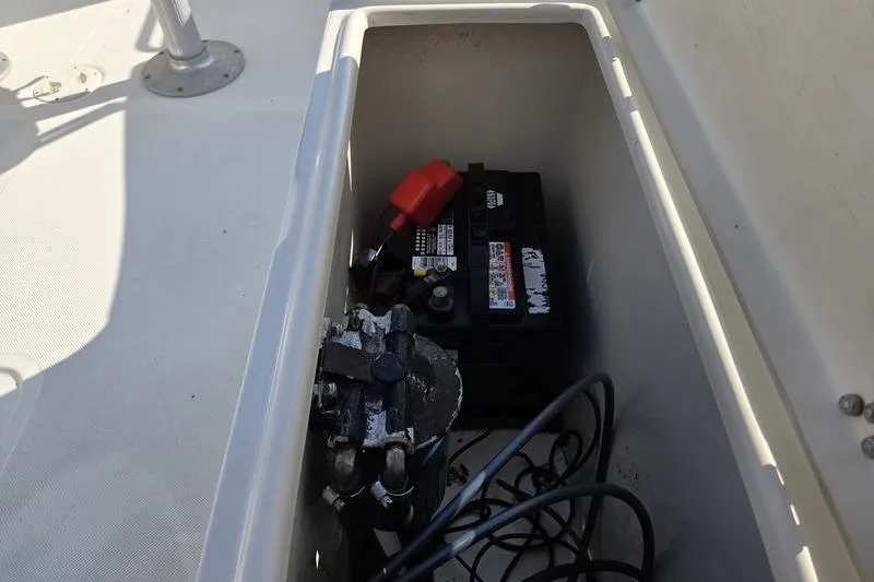 Slide: The Image of Battery compartment of a 2000 Scout 185 Sportfish boat, showing wiring and connections. - 8