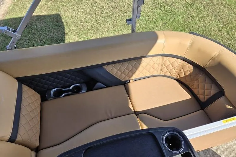 Slide: The Image of Luxurious seating on 2023 Godfrey AquaPatio 255 SBW iMPACT pontoon boat, featuring quilted upholstery. - 14