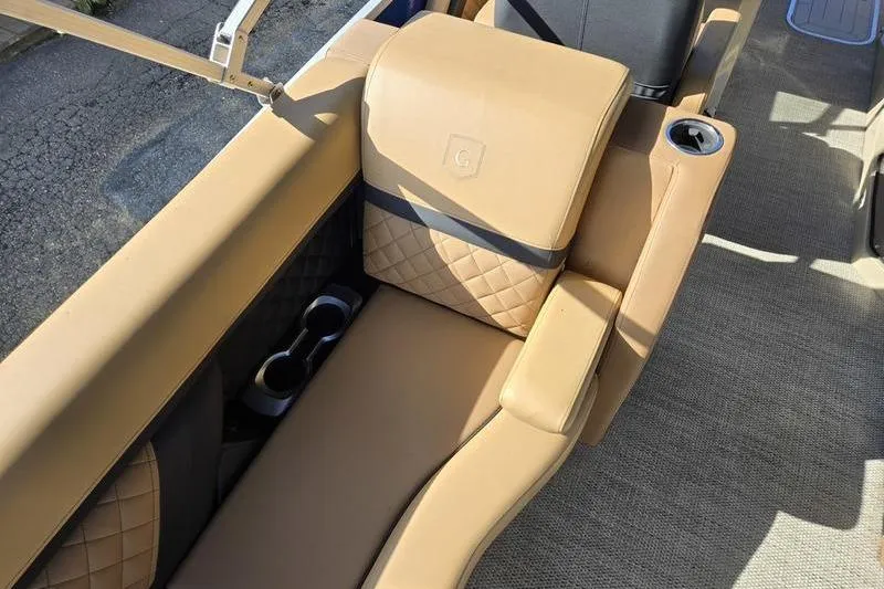Slide: The Image of Luxurious tan seating on 2023 Godfrey AquaPatio 255 SBW iMPACT pontoon boat. - 18