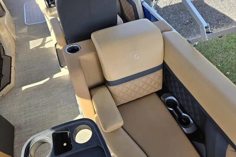 Slide: The Image of Luxurious seating on 2023 Godfrey AquaPatio 255 SBW iMPACT pontoon boat with cup holders. - 20