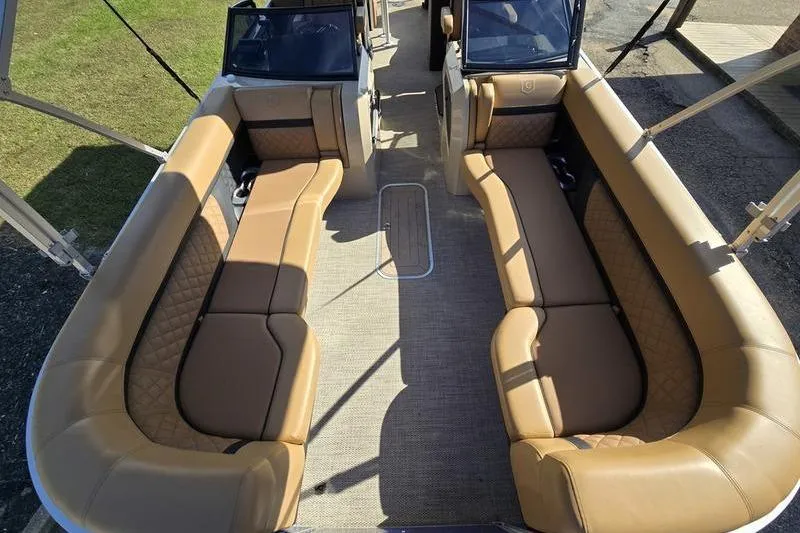 Slide: The Image of 2023 Godfrey AquaPatio 255 SBW iMPACT interior with tan seating and spacious layout. - 5
