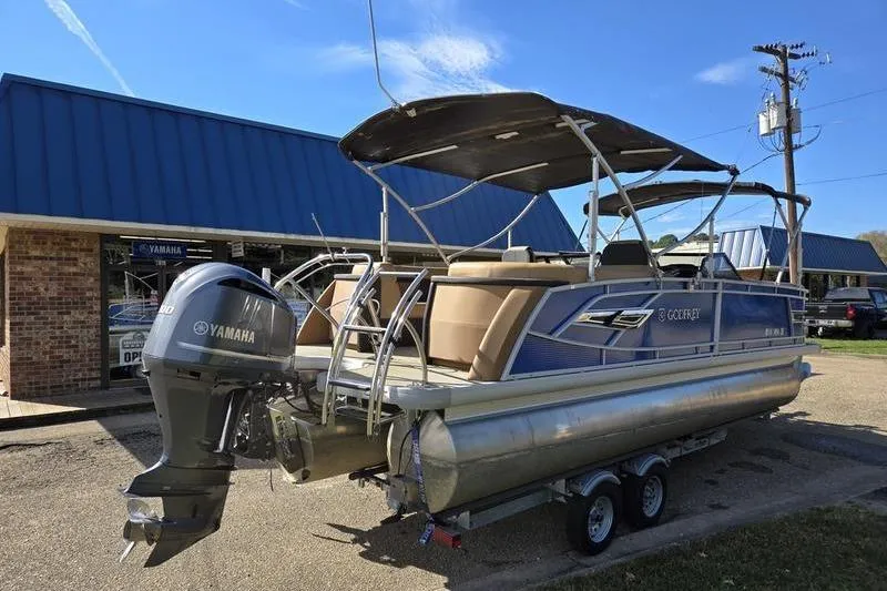 Slide: The Image of 2023 Godfrey AquaPatio 255 SBW pontoon boat with Yamaha engine, parked on trailer. - 6