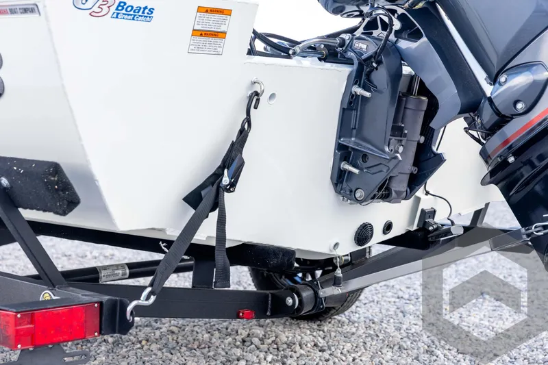 Slide: The Image of 2026 G3 Sportsman 1710 SE boat on trailer, showing motor and secure straps. - 23