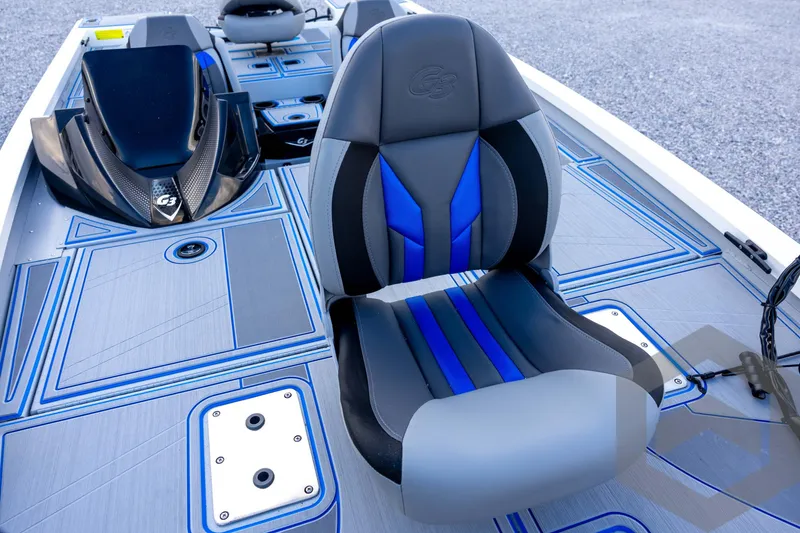 Slide: The Image of 2026 G3 Sportsman 1710 SE boat interior with blue and gray seating and deck design. - 38