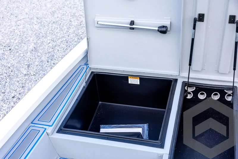 Slide: The Image of 2026 G3 Sportsman 1710 SE boat storage compartment with open lid and hydraulic supports. - 44
