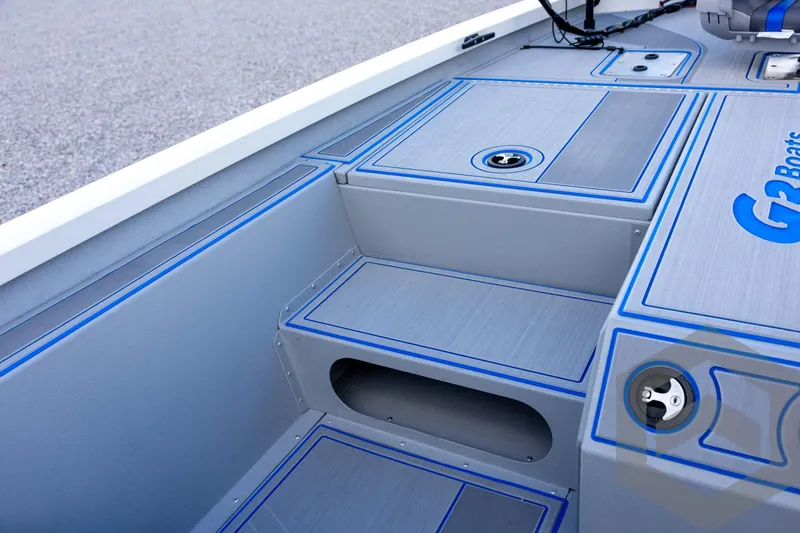 Slide: The Image of 2026 G3 Sportsman 1710 SE boat interior with sleek gray and blue design. - 47