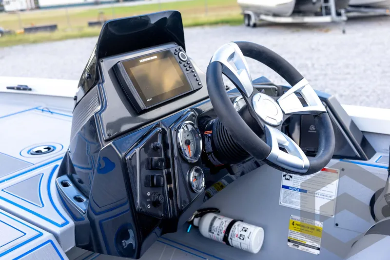 Slide: The Image of 2026 G3 Sportsman 1710 SE boat dashboard with steering wheel and navigation display. - 48