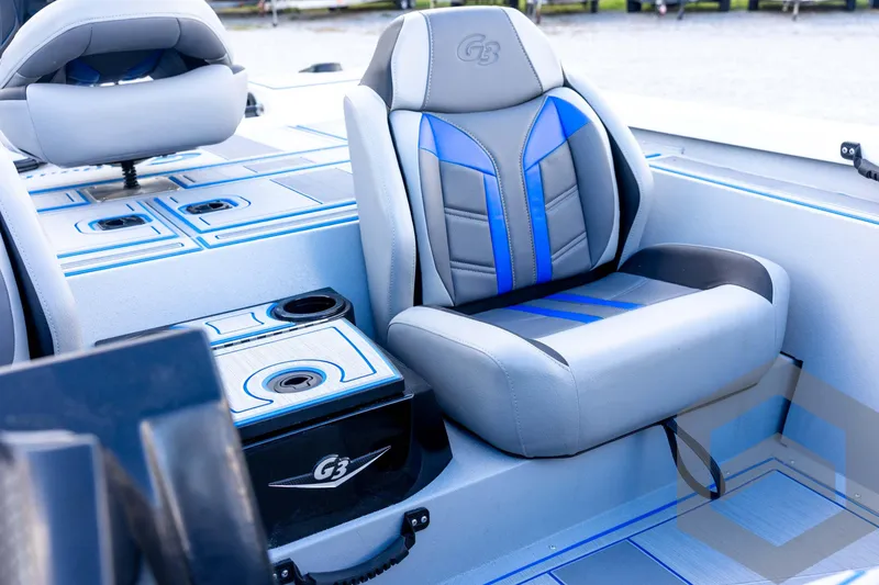 Slide: The Image of 2026 G3 Sportsman 1710 SE boat interior with blue and gray seating. - 49