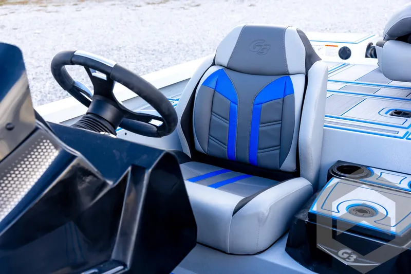 Slide: The Image of 2026 G3 Sportsman 1710 SE boat interior with steering wheel and blue-accented seat. - 50