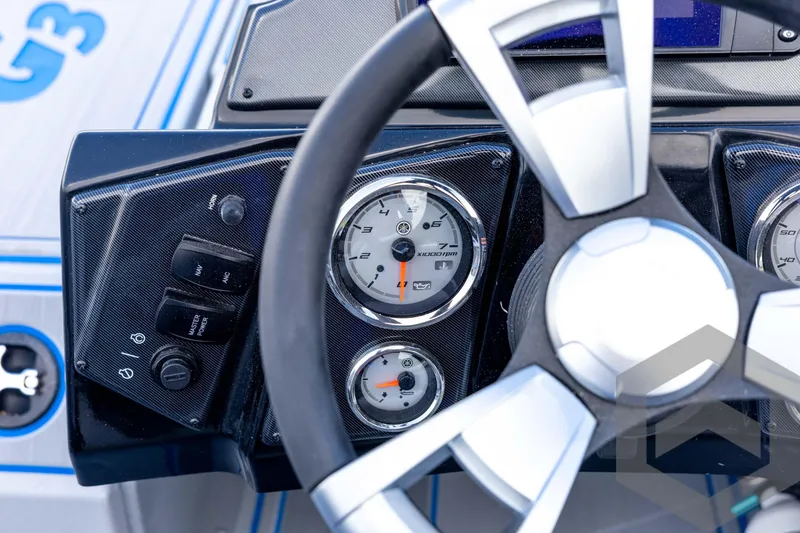 Slide: The Image of Dashboard of 2026 G3 Sportsman 1710 SE boat with steering wheel and gauges. - 56