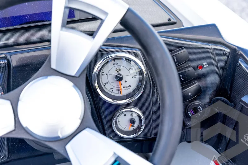Slide: The Image of 2026 G3 Sportsman 1710 SE dashboard with speedometer and control switches. - 57