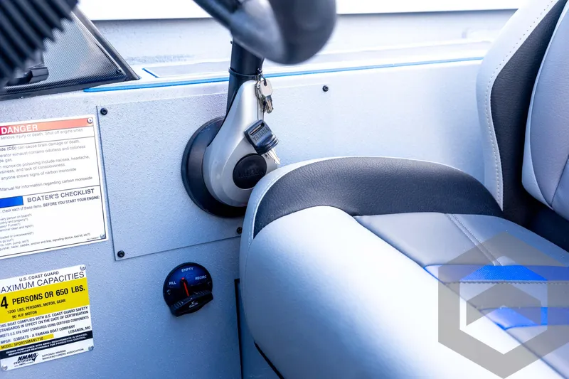 Slide: The Image of 2026 G3 Sportsman 1710 SE boat interior with ignition and capacity warning labels. - 59