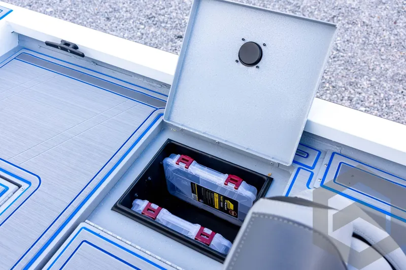 Slide: The Image of 2026 G3 Sportsman 1710 SE boat storage compartment with tackle boxes. - 64