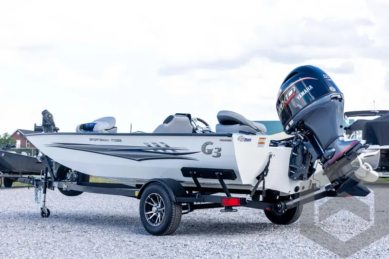 Slide: The Image of 2026 G3 Sportsman 1710 SE boat with Yamaha engine on trailer, parked outdoors. - 7