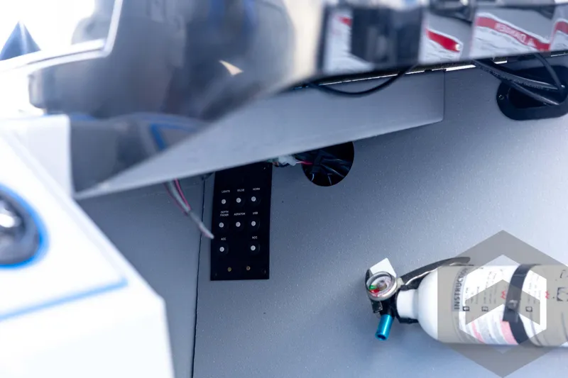 Slide: The Image of Control panel and fire extinguisher inside 2026 G3 Sportsman 1710 SE boat. - 70
