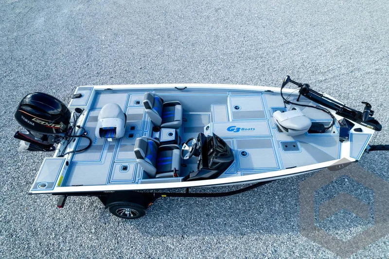 Slide: The Image of 2026 G3 Sportsman 1710 SE boat with Yamaha engine, aerial view on gravel surface. - 78