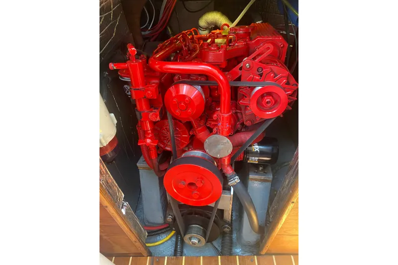 Slide: The Image of Red engine of a 1984 Sabre MK 1 boat, detailed view. - 14