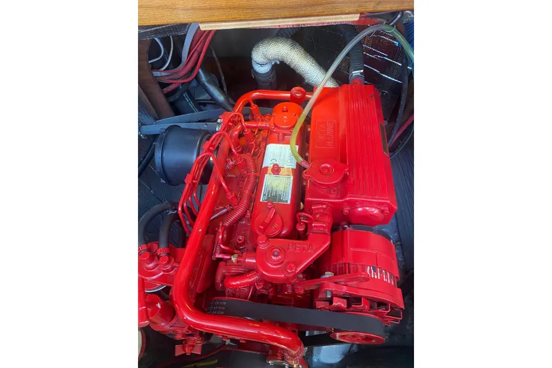 Slide: The Image of Red Sabre MK 1 engine from 1984, detailed view with components and wiring. - 15