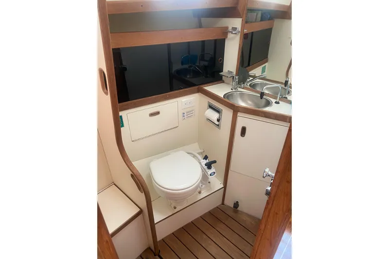 Slide: The Image of Cockpit view of 1984 Sabre MK 1 sailboat with ropes and canopy on a sunny day. - 5