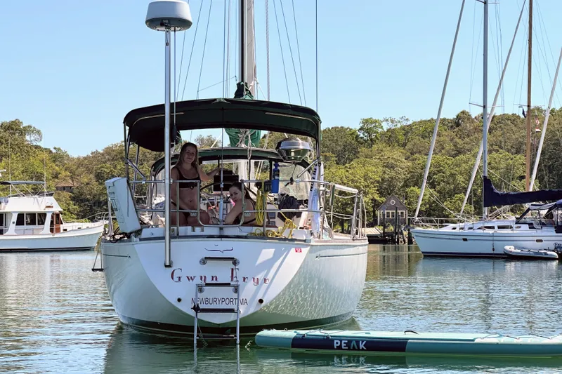 Slide: The Image of Sailboat "Gwyn Eryr" in harbor, Sabre MK 1, 1984, with paddleboard nearby. - 7