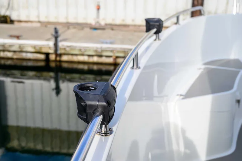 Slide: The Image of 2019 Targa 27.2 boat railing with mounted accessories at a dock. - 12