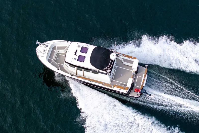 Slide: The Image of Aerial view of 2019 Targa 27.2 boat cruising on open water. - 5
