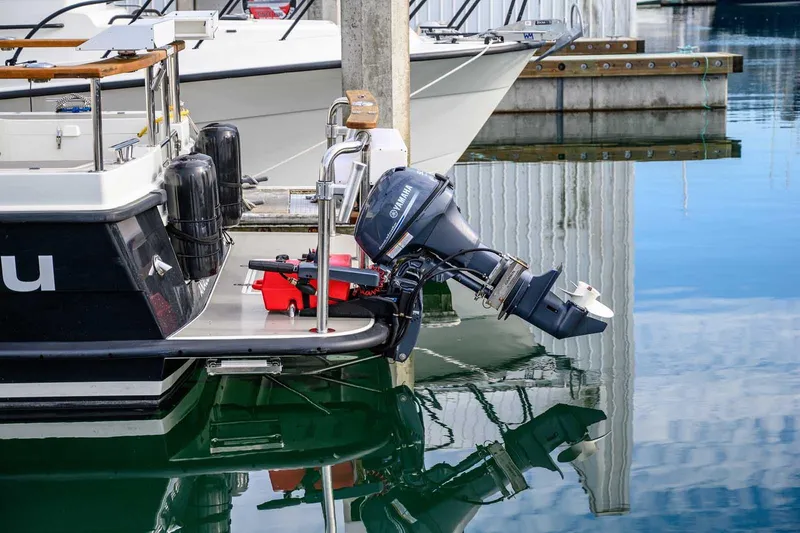 Slide: The Image of 2019 Targa 27.2 boat docked with Yamaha outboard motor in marina. - 7