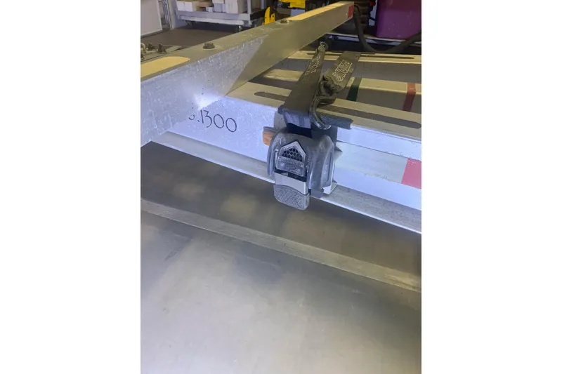Slide: The Image of 2001 Corsair 31 UC trailer hitch with secure locking mechanism in a workshop setting. - 11