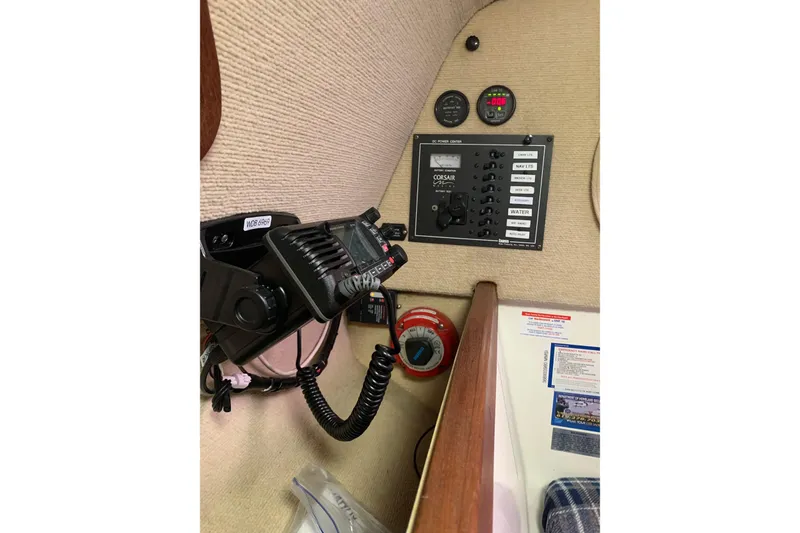 Slide: The Image of Control panel of a 2001 Corsair 31 UC boat with communication equipment. - 6
