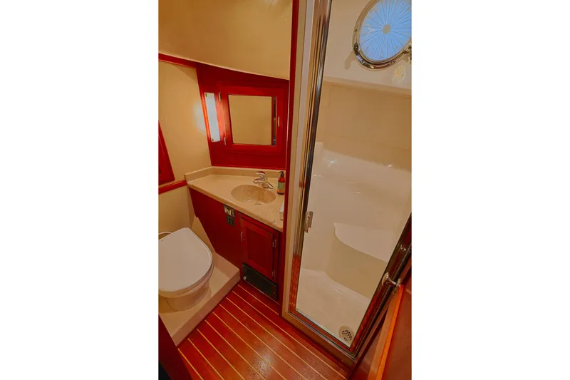 Slide: The Image of Luxurious bathroom in 2007 American Tug 41 yacht with shower, sink, and toilet. - 17