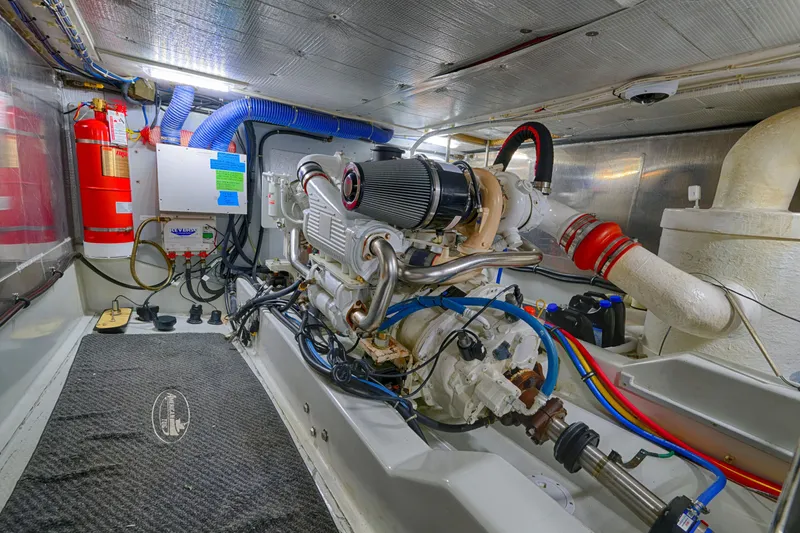 Slide: The Image of Engine room of 2007 American Tug 41, featuring machinery and fire safety equipment. - 20