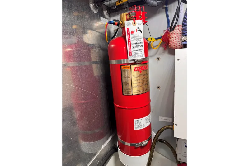 Slide: The Image of Fire extinguisher in 2007 American Tug 41 engine room, mounted on wall. - 27