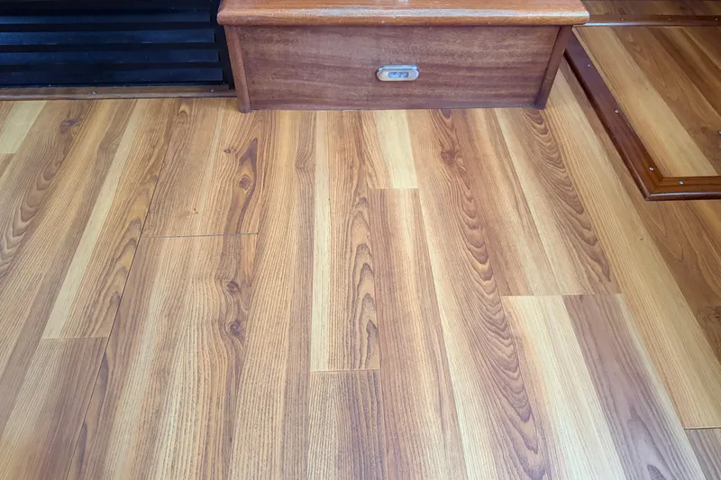 Slide: The Image of Wooden flooring inside a 2007 American Tug 41 boat, showcasing elegant design. - 33