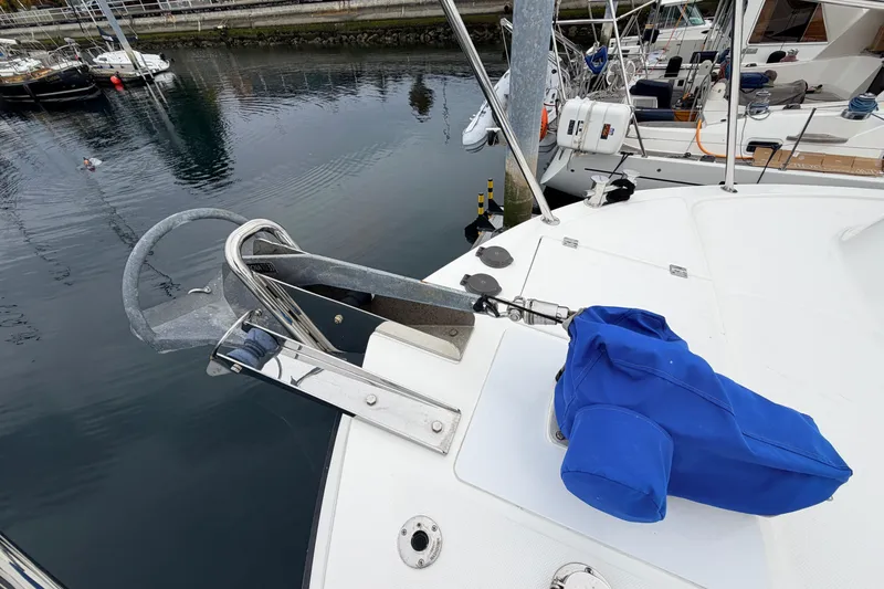 Slide: The Image of Bow of a 2007 American Tug 41 with anchor and blue cover. - 36