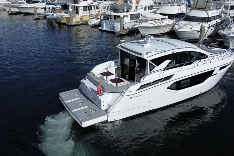 Slide: The Image of 2022 Cruisers Yachts 42 Cantius in marina, sleek design, luxury motor yacht. - 22