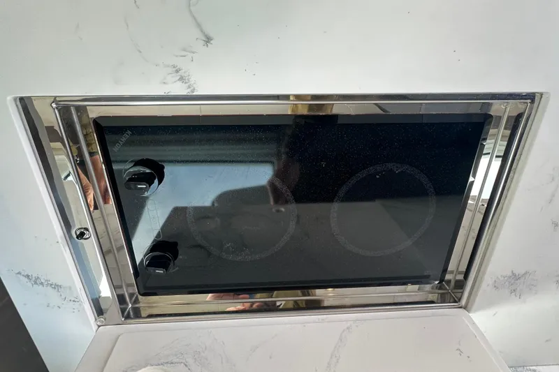 Slide: The Image of Built-in stovetop on 2022 Cruisers Yachts 42 Cantius, featuring sleek design and modern controls. - 30