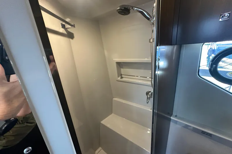 Slide: The Image of 2022 Cruisers Yachts 42 Cantius bathroom with modern shower and window. - 37