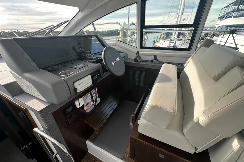 Slide: The Image of 2022 Cruisers Yachts 42 Cantius helm with modern controls and comfortable seating. - 39