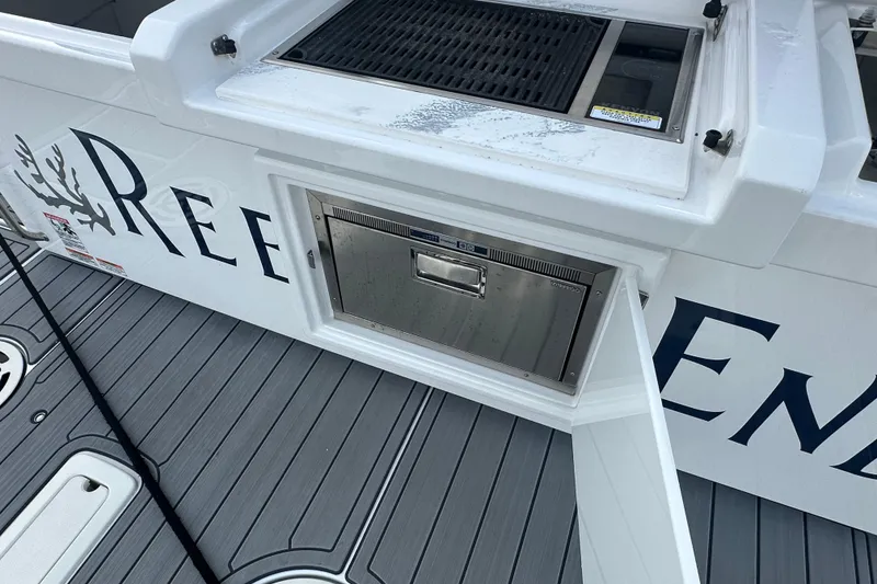 Slide: The Image of 2022 Cruisers Yachts 42 Cantius deck with built-in grill and storage. - 44