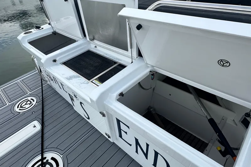 Slide: The Image of 2022 Cruisers Yachts 42 Cantius deck with open storage compartments and grill. - 45