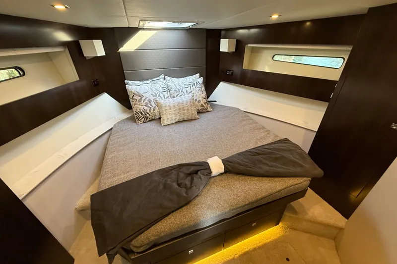 Slide: The Image of Luxurious bedroom interior of 2022 Cruisers Yachts 42 Cantius with modern design and cozy bedding. - 5