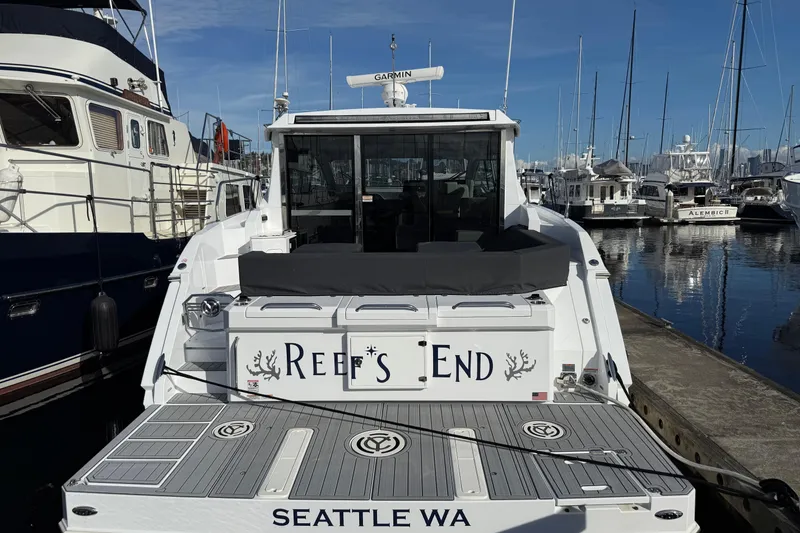 Slide: The Image of 2022 Cruisers Yachts 42 Cantius docked in Seattle marina, rear view. - 6