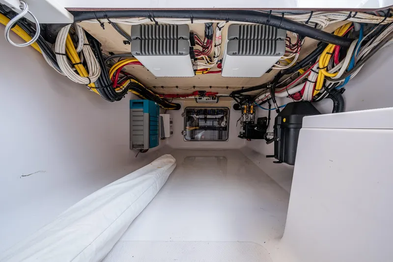 Slide: The Image of Interior view of a 2015 Bahama 41 boat's electrical wiring and equipment compartment. - 15