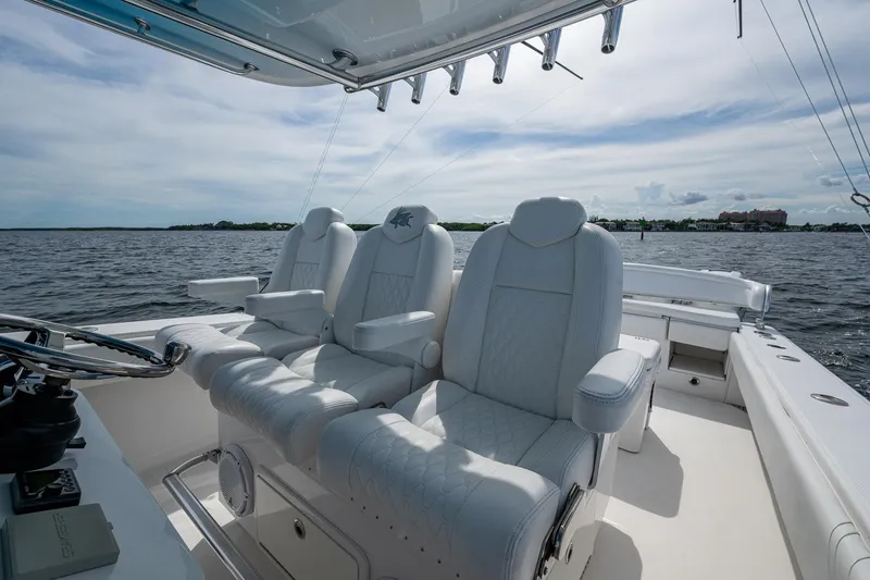 Slide: The Image of Luxurious seating on a 2015 Bahama 41 boat with ocean view. - 19
