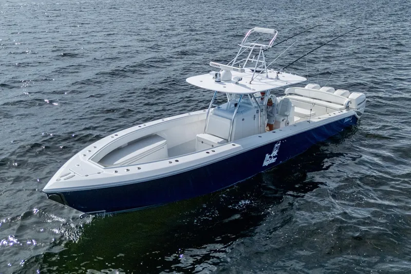 Slide: The Image of 2015 Bahama 41 boat on open water, featuring sleek design and spacious deck. - 22