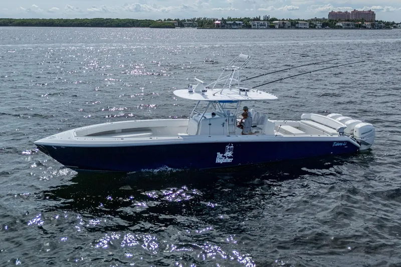 Slide: The Image of 2015 Bahama 41 boat cruising on open water under a clear sky. - 24